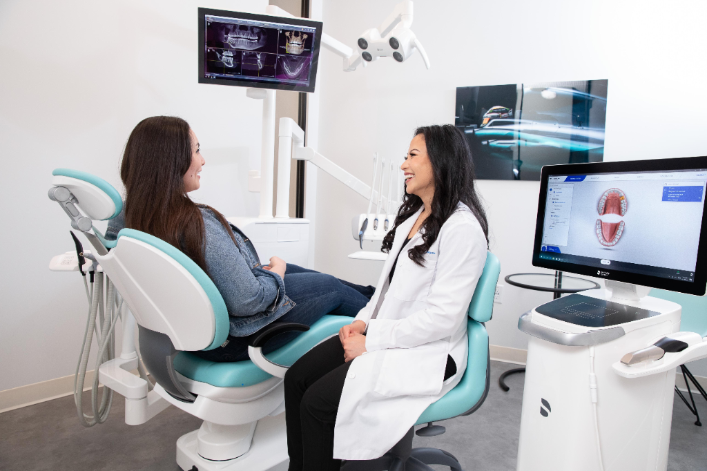 Castletroy dentist reviewing a patient's 3D dental scan on a chairside monitor