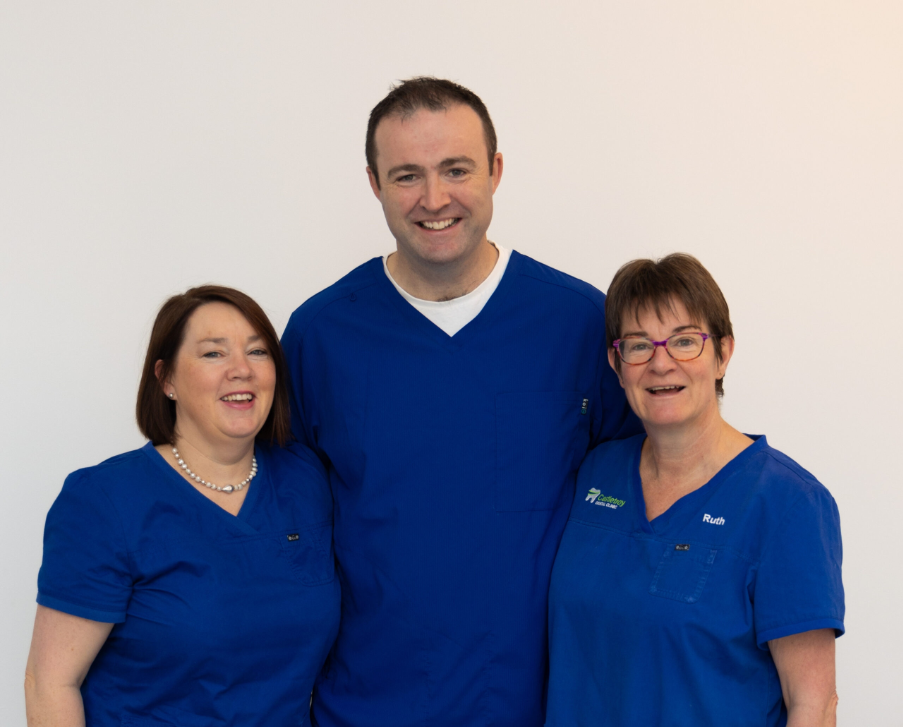Castletroy Dental Clinic team of dentists, hygienists and dental nurses in blue scrubs