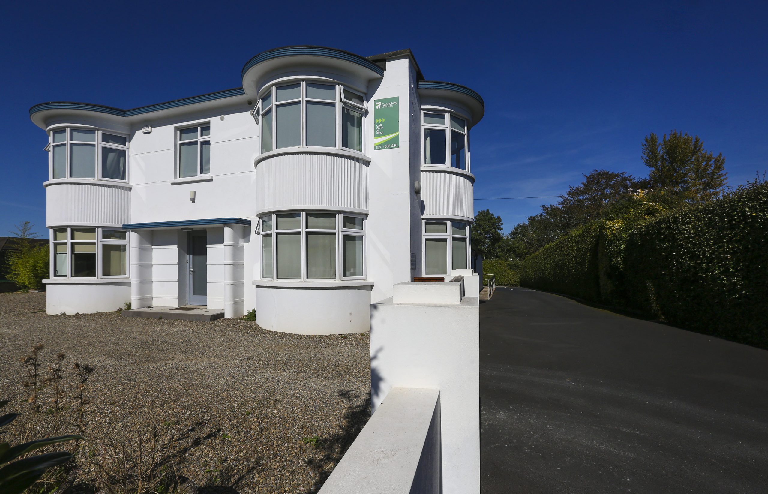 The white Art Deco Castletroy Dental Clinic building viewed from the Dublin Road entrance