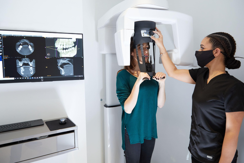 Dental nurse positioning a patient for a low-dose 3D CBCT scan at Castletroy Dental Clinic